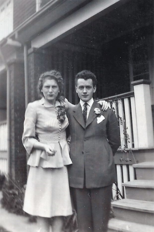 Wedding photograph of Mac & Nora Crozier standing outside a house in Toronto, 1943