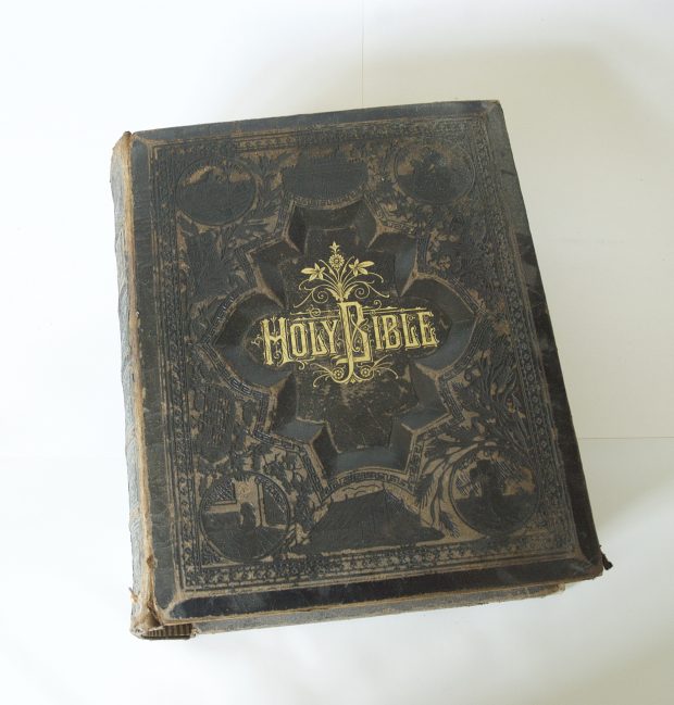 Large leather bound Bible. The leather is tooled with the words Holy Bible tooled into the leather and print is in gold colour.