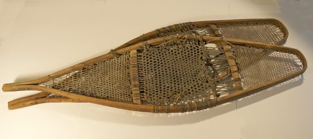 Two Large Snowshoes. Hardwood frames with rawhide lacings.