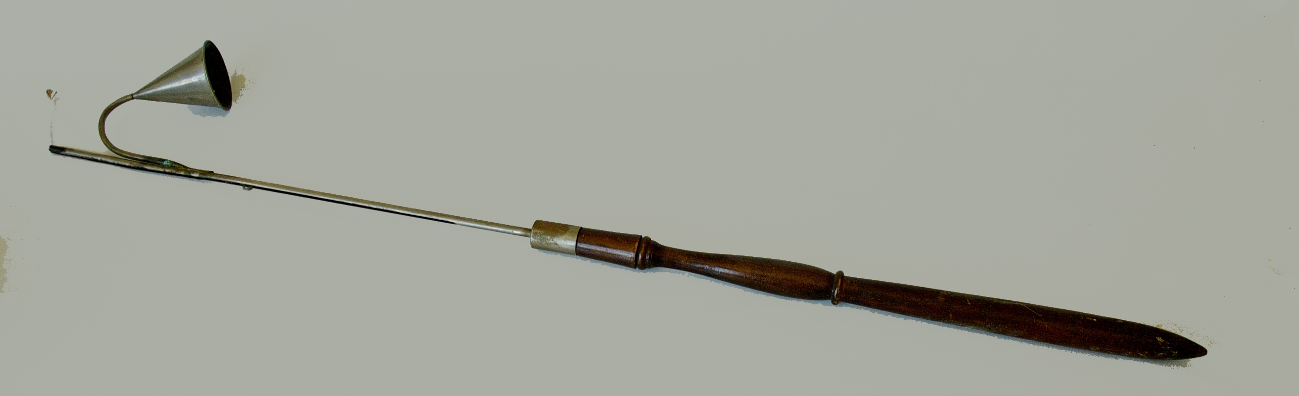 A candle snuffer with a wooden handle