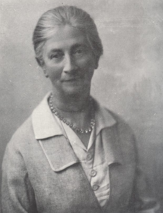 Black and White image of Katherine E. Wallis in her late 60s, with grey hair tied in a bun.