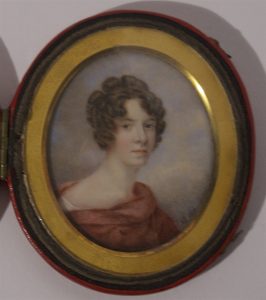 A self portrait minature painting of Anne Langton. Watercolour on ivory. 8.4 cm x presented in a small round locket that has a leather/fabric cover.