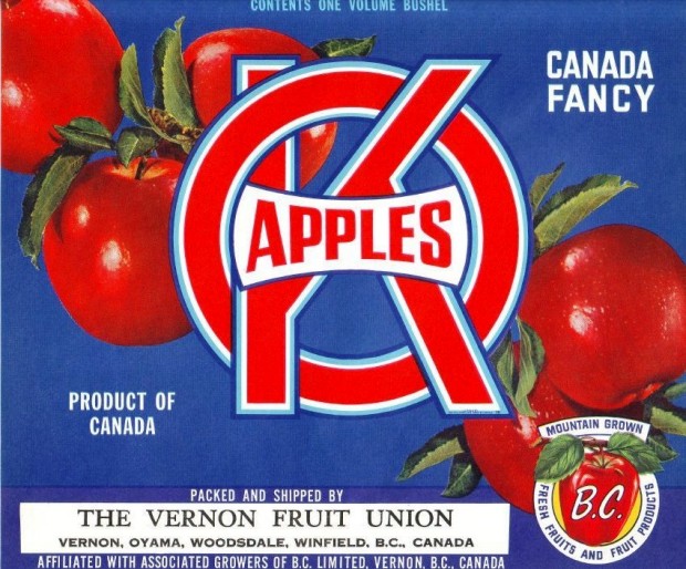 Colour photo of an OK Brand apple box label. The label has red and white lettering and five red apples on a blue background.