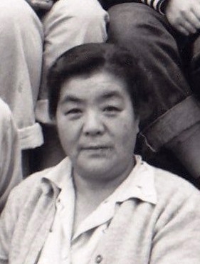 Black and white head shot photo of a middle aged Japanese woman.