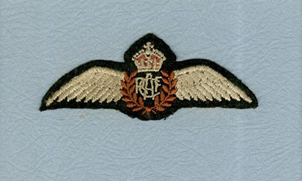 A coloured photo of Lamont Parsons' Flying Wing badge on a blue background.