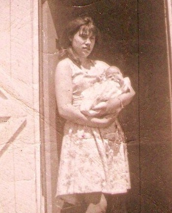 Jane Hayse with baby. This picture is of Jane Hayse just before she left Parker's Cove to go to St. John's to work.