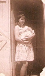 Jane Hayse with baby. This picture is of Jane Hayse just before she left Parker's Cove to go to St. John's to work.