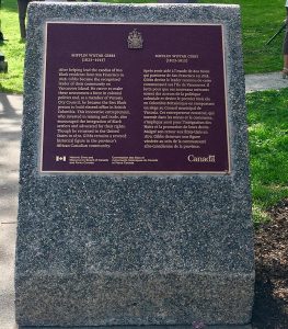 plaque de bronze sur socle en béton