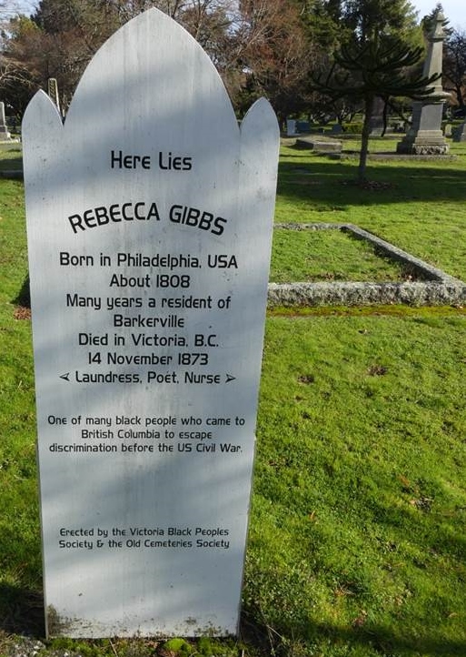 white 4-foot high grave-maker with black lettering.