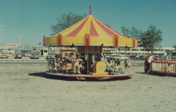 A small carousel at a carnival midway