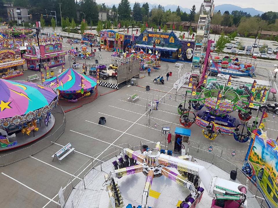 Bird's eye view of a carnival midway set up in a parking lot