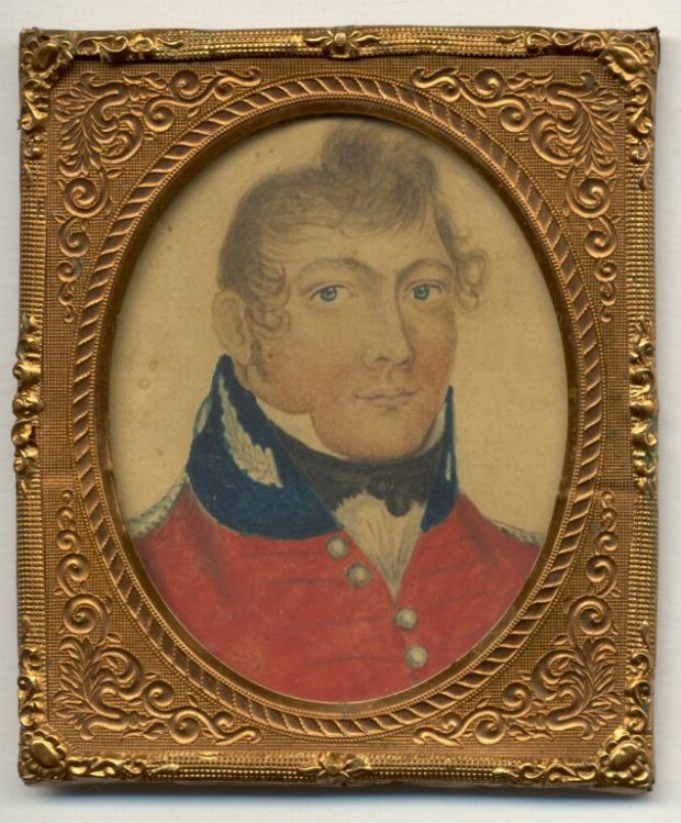 Coloured portrait in a gold frame of a white man wearing a red military tunic identified as Lt.Col Isaac Allen.