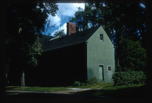 Colour photograph of the backside of a house identified as Odell House Slave Quarters.