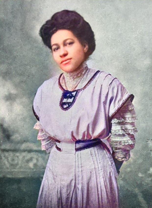 Colourised photograph of Mary Matilda Winslow, prettily dressed in a mauve dress.