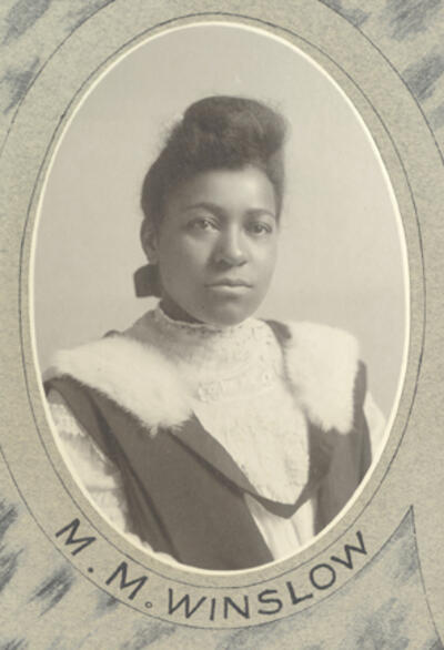 Head and shoulders photograph of Mary Matilda Winslow in her graduation gown.