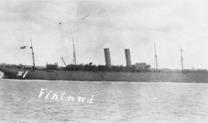 A side view of a large, two-masted ship.