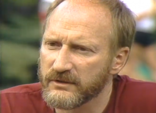 Co-founder of the Gay Games, Tom Waddell, is interviewed by Mary Anne McEwen at a park picnic table at the 1983 Vancouver Gay Summer Games.