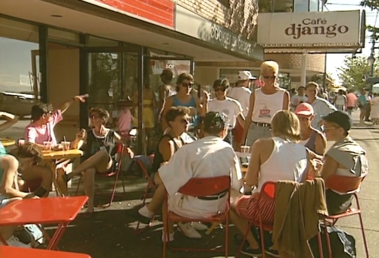 International and local LGBTQ2S+ athletes mingle openly a streetside cafe in Vancouver.