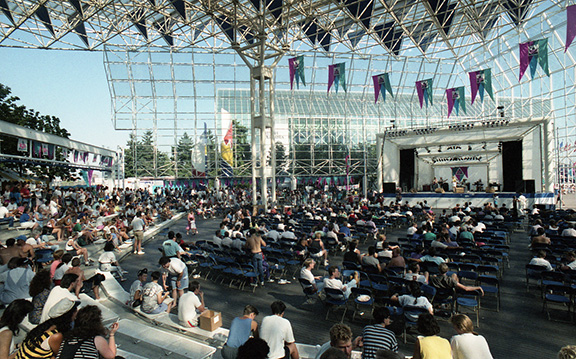 A wide-angle shot of the crowd and open air Plaza of Nations, including the Plaza Stage.