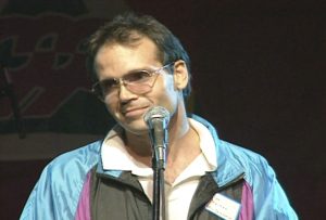 Ceremonies producer, Max Reimer, addresses volunteers at the Celebration '90 Pep Rally.