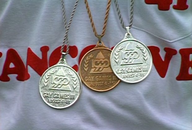 Close up of Gay Games III medals won, and being worn by, Vancouver track athlete, Eric Graff, at Swangard Stadium, Burnaby.