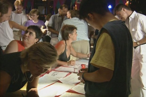 Staff and board signing up new volunteers at a recruitment drive and pep rally at the Commodore Ballroom.