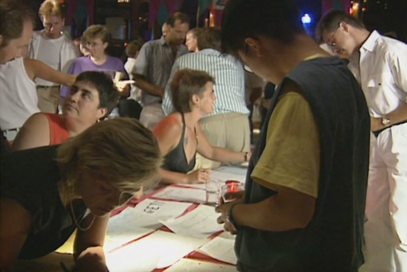 Staff and board signing up new volunteers at a recruitment drive and pep rally at the Commodore Ballroom.
