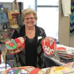 Raymonde surrounded by her many creations at the 2019 exhibition and sale