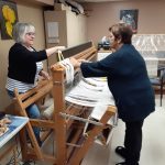 Johanne Désormeaux and Ginette Blais set up a loom