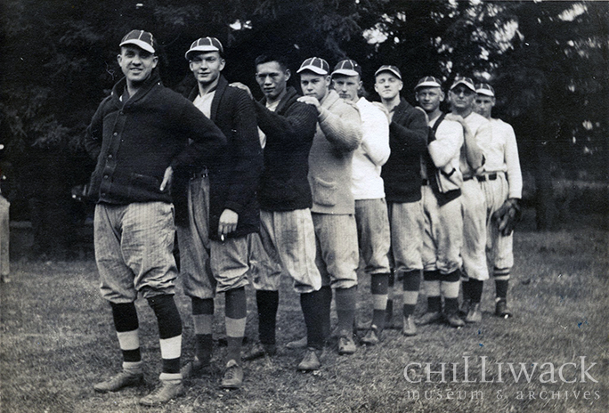 Group portrait of nine members of the Chilliwack Baseball Team standing in a row