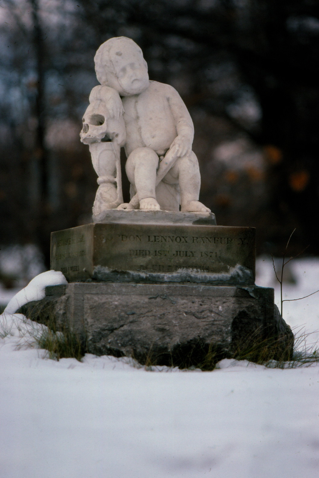 Marble baby headstone in the winter