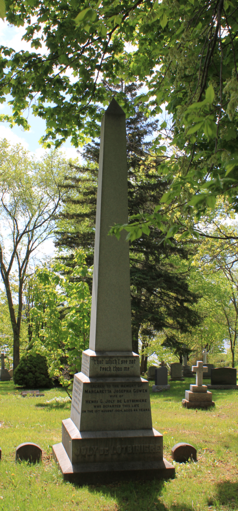 a large brown monument in the trees