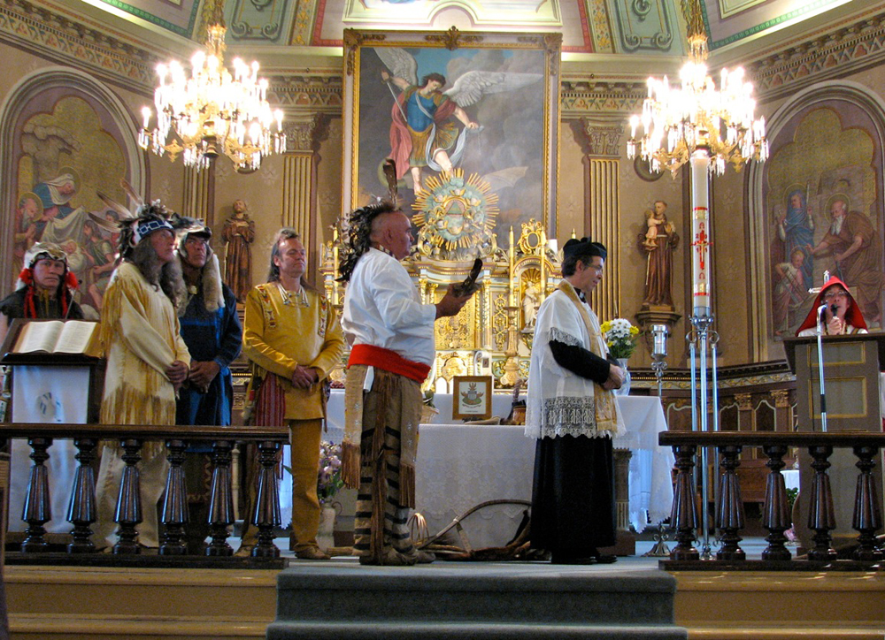 Color photograph, richly decorated church interior, religious celebration where the participants are dressed in period costumes.