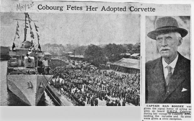 newspaper article with two black and white photographs, one of Captain Dan Rooney, the other of a military ship at dock with crew lined up on dock and large crowd of people behind