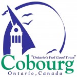 the word Cobourg appears in large green letters near the bottom with Ontario, Canada in blue beneath. Against a white background a stylized sail in blue outlines a cupola. The sail and three stylized birds, also in blue, are enclosed by a half circle blue ribbon.