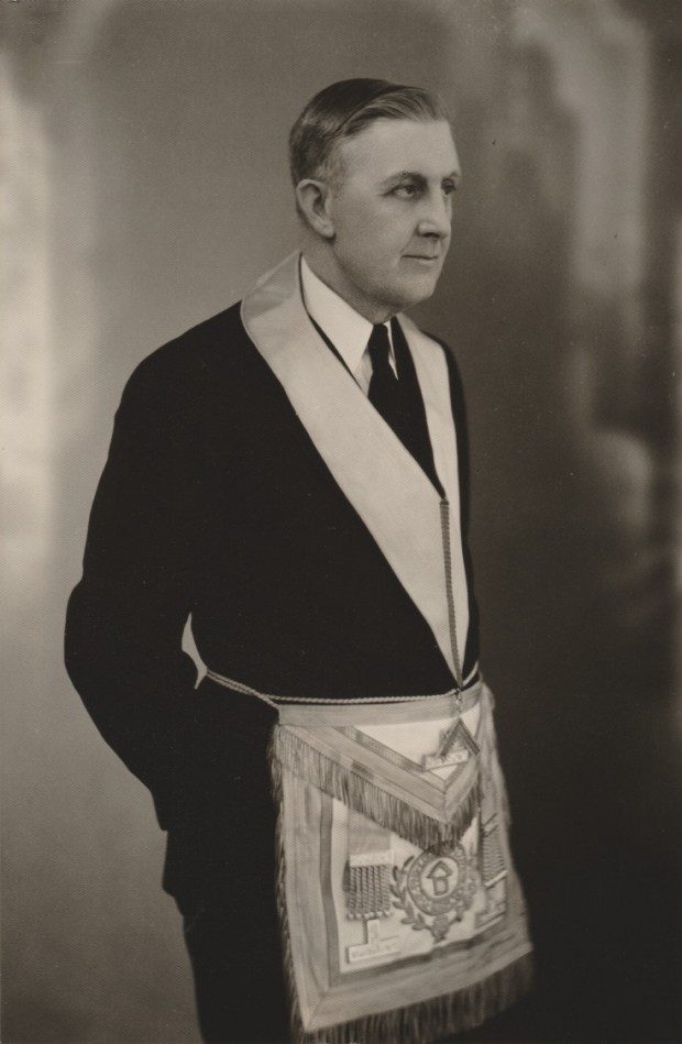 Charles McLeod is dressed in masonic regalia. He is wearing a dark suit and the photograph was taken of him looking off to his left.