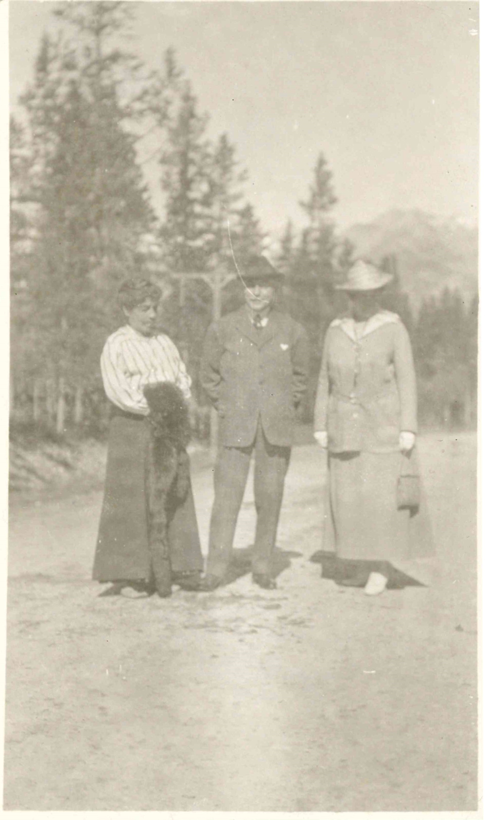 Photo of Belle (left), James (centre), and Miss Merritt (right) taken at Banff