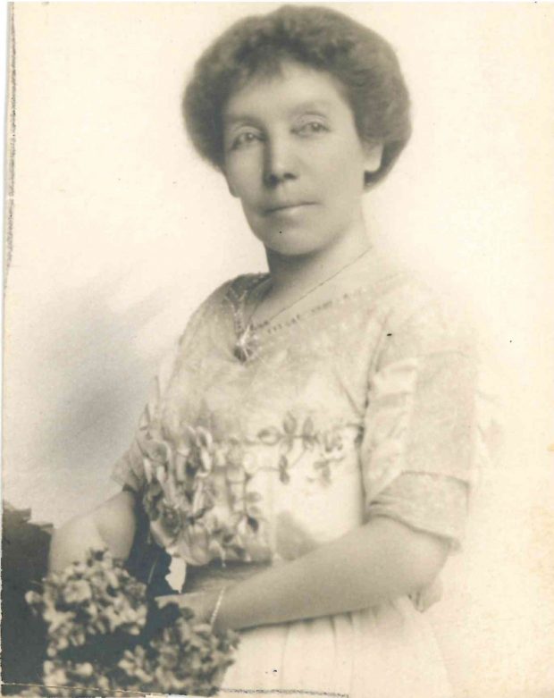 Photo of Isabella Lougheed, holding flowers.