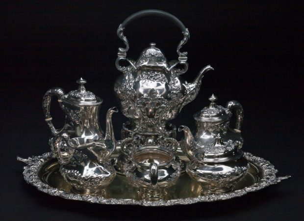 Photo of a silver tea set belonging to the Lougheeds with letter L engraved on the component parts