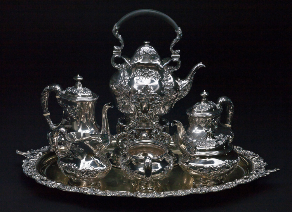 Photo of a silver tea set belonging to the Lougheeds with letter "L" engraved on the component parts