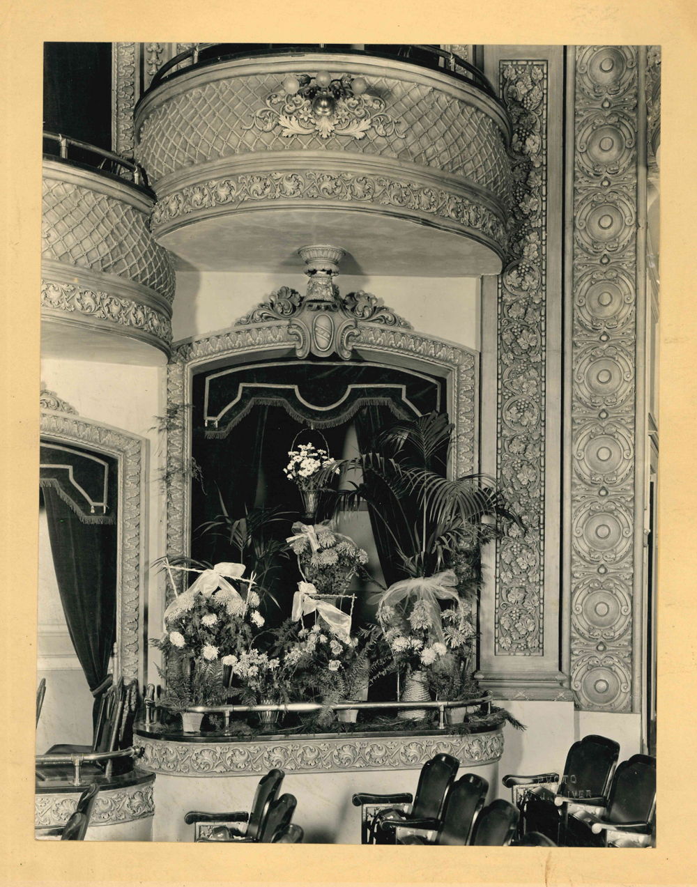 Photo of the Lougheed family box at the Grand Theatre. Flowers and wreaths suggest it may have been after the death of a family member.