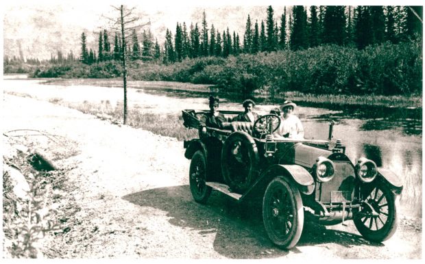 Old car on road at Banff