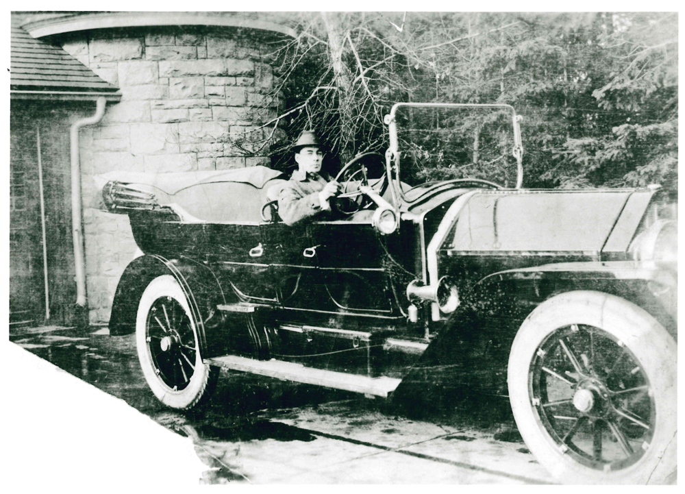 Family member in old car by Beaulieu