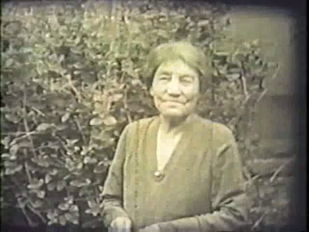 A period photograph of Lady Lougheed taken in a garden