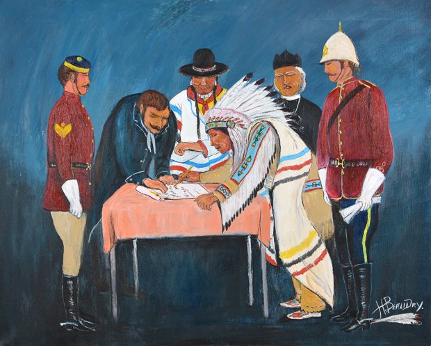 Six people standing around a table while a Chief in regalia signs a document