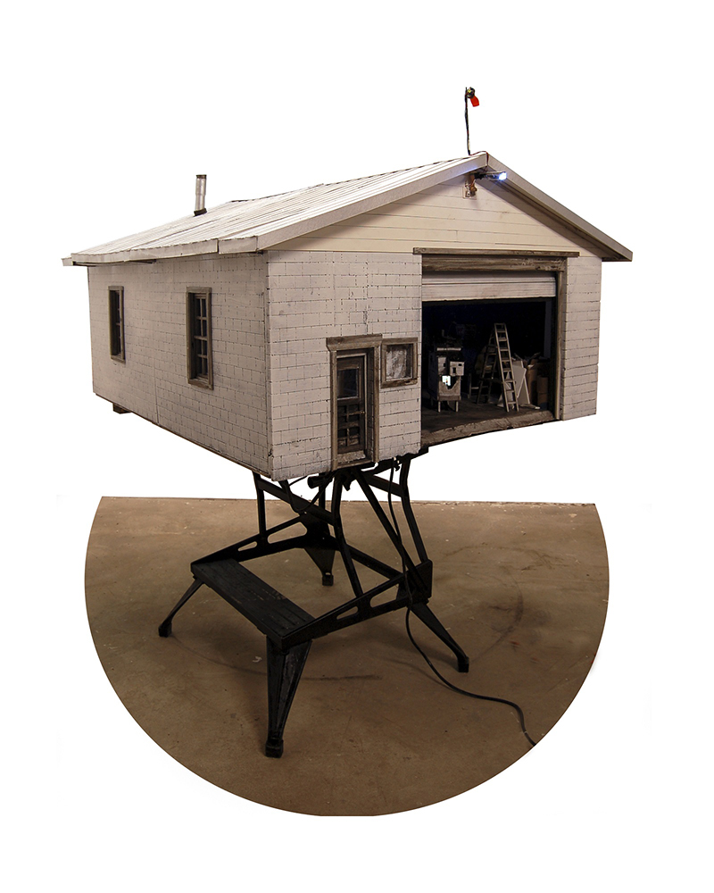 Model of a garage containing several smaller models