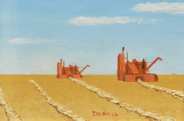 Machines collecting grain in a field