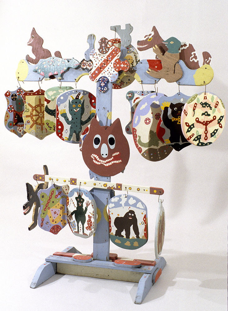 Blue wooden stand with several pictures hanging from it. Pictures are of various creatures and patterns.