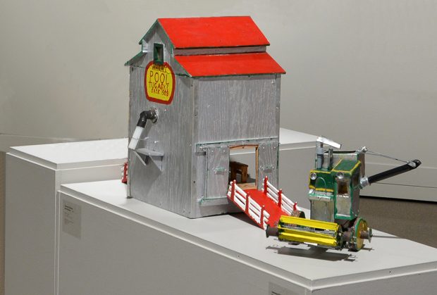 Models of a grain elevator and a farm machine