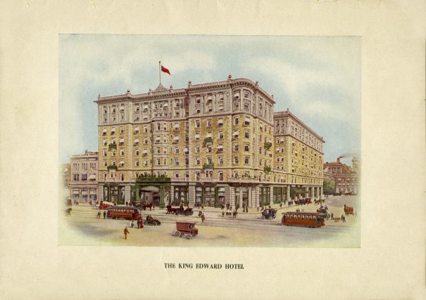 Exterior façade of the hotel with streetcars and carriages, and many people walking around.
